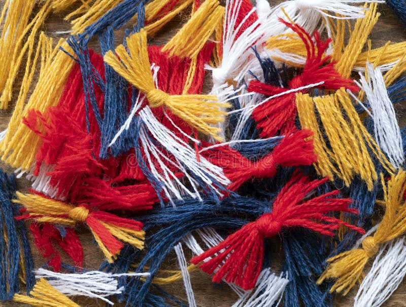 Colored threads with knots, remnants from weaving, selective focus. Textile waste, unnecessary tailings. Colored threads with knots, remnants from weaving, selective focus. Textile waste, unnecessary tailings