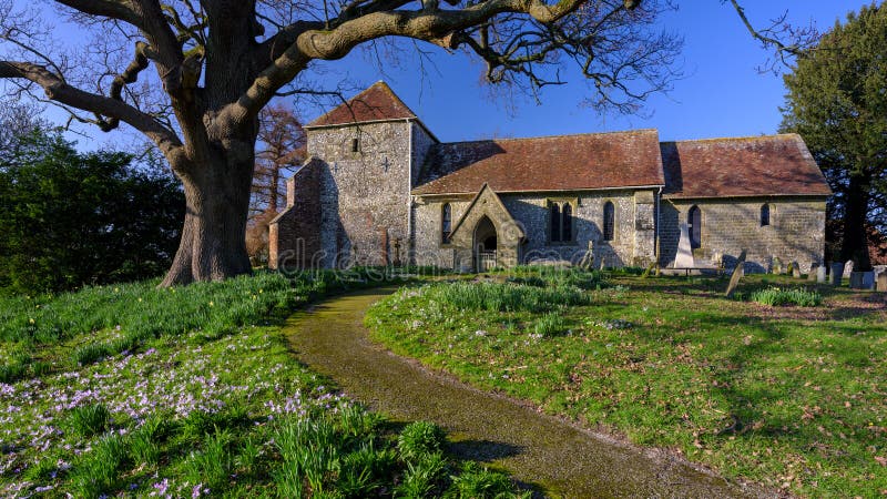 Bepton, UK - February 27, 2021:  St Mary`s church at Bepton on the foothills of the South Downs in West Sussex, UK. Bepton, UK - February 27, 2021:  St Mary`s church at Bepton on the foothills of the South Downs in West Sussex, UK