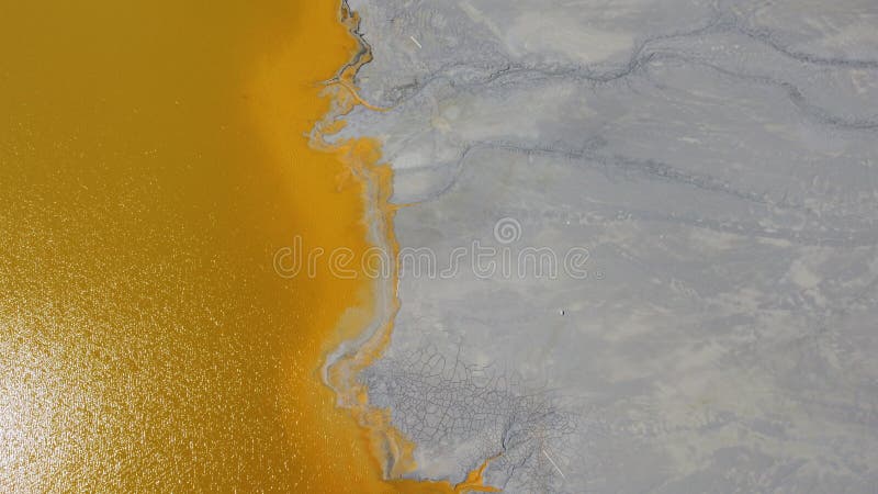 Aerial View Over a Big Waste Lake Polluted With Toxic Mining Residuals Tailings From an Open Pit Copper Mine in Geamana, Rosia Poieni, Romania. Aerial View Over a Big Waste Lake Polluted With Toxic Mining Residuals Tailings From an Open Pit Copper Mine in Geamana, Rosia Poieni, Romania