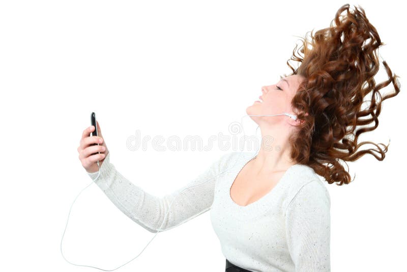 Beautiful fourteen year old girl listening to digital music player. Beautiful fourteen year old girl listening to digital music player.