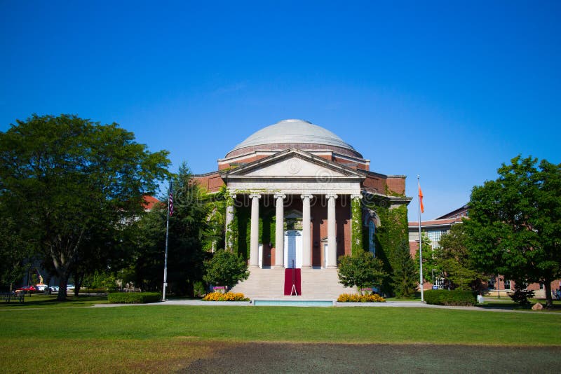 Hendricks Chapel is situated in the middle of the Syracuse campus, perpendicular to the Quad. Built in 1930, Hendricks was the third largest University chapel in the country at the time of its construction and seats 1,450 people. The chapel's architects were James Russell Pope and Dwight James Baum from the Class of 1909. Francis Hendricks, a state senator and SU trustee, donated the chapel honoring his late wife. The Georgia limestone and brick chapel serves all faiths. The chapel's pulpit was a gift from the Class of 1918 while the Aeolian organ was a gift of Francis Hendricks' niece, Kathryn but was replaced in 1952. Hendricks Chapel is situated in the middle of the Syracuse campus, perpendicular to the Quad. Built in 1930, Hendricks was the third largest University chapel in the country at the time of its construction and seats 1,450 people. The chapel's architects were James Russell Pope and Dwight James Baum from the Class of 1909. Francis Hendricks, a state senator and SU trustee, donated the chapel honoring his late wife. The Georgia limestone and brick chapel serves all faiths. The chapel's pulpit was a gift from the Class of 1918 while the Aeolian organ was a gift of Francis Hendricks' niece, Kathryn but was replaced in 1952.