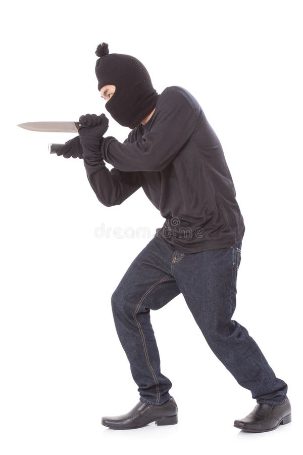 Man in a mask holding flashlight with a knife on a white background. Man in a mask holding flashlight with a knife on a white background