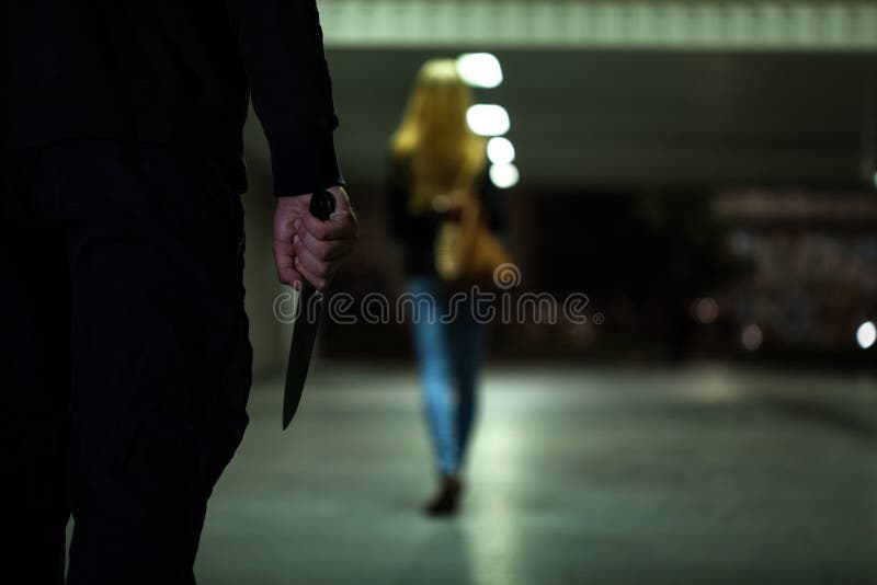 Man with knife following women at night. Man with knife following women at night