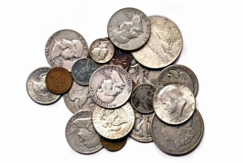 Several old coins stacked in a pile isolated on a white background. Includes: Wheat penny, Steel Penny, Franklin Half Dollar, Kennedy Half Dollar, Mercury Dime, Susan B Anthony, Buffalo Nickle, Walking Liberty Half Dollar, and more. Several old coins stacked in a pile isolated on a white background. Includes: Wheat penny, Steel Penny, Franklin Half Dollar, Kennedy Half Dollar, Mercury Dime, Susan B Anthony, Buffalo Nickle, Walking Liberty Half Dollar, and more.