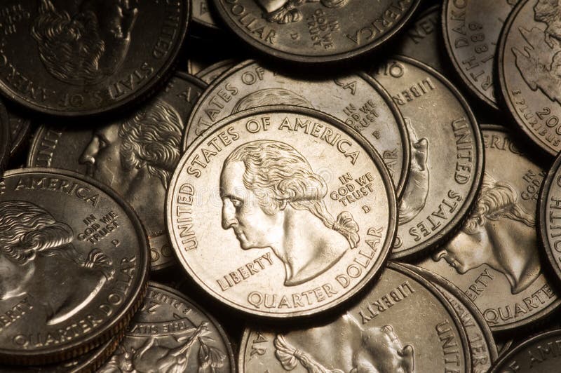 Pile of American Quarter Dollar Coins. Lighting & focus centered on middle coin. Pile of American Quarter Dollar Coins. Lighting & focus centered on middle coin.