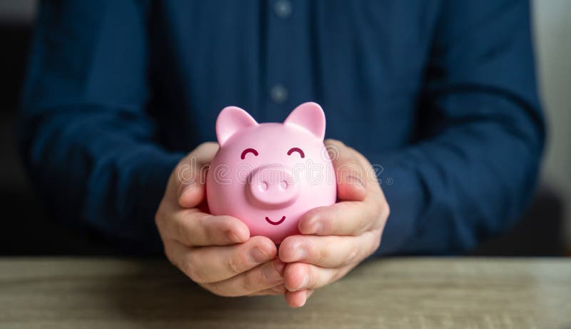 A man protects his savings. The piggy bank is in good hands. Savings and deposit banking. Wealth and prosperity. Healthy economy. Successful investments and deposits. Money protection. A man protects his savings. The piggy bank is in good hands. Savings and deposit banking. Wealth and prosperity. Healthy economy. Successful investments and deposits. Money protection