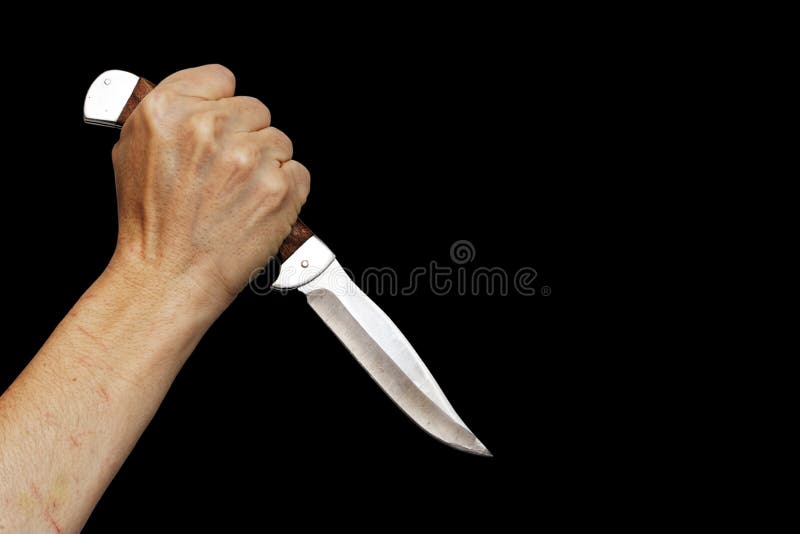 Human hand holding knife isolated on black. Copyspace. Human hand holding knife isolated on black. Copyspace.