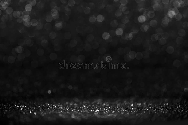 Черная пятница bokeh фон. Элегантный дизайн плана размыть тени. Серебро и черный место за столом с фарой glitter. Роскошь Черная пятница bokeh фон. Элегантный дизайн плана размыть тени. Серебро и черный место за столом с фарой glitter. Роскошь