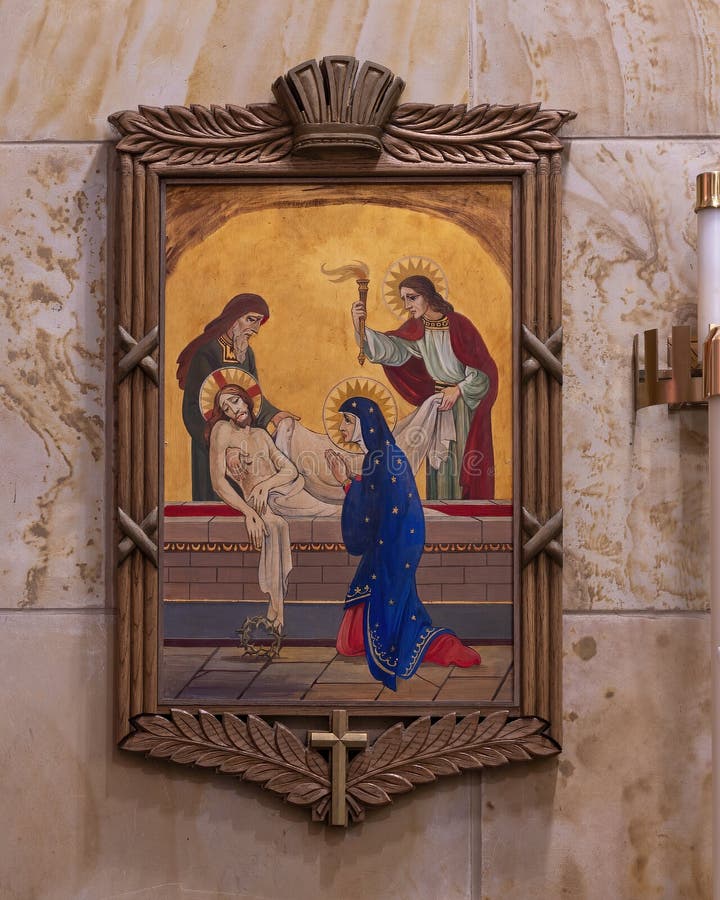 Pictured is the fourteenth of the Fourteen Stations of the Cross located on the walls of the inside of Christ the King Catholic Church in Dallas, Texas.  In the fourteenth station Jesus is laid in the tomb.  The Fourteen Stations of the Cross were designed and executed by Leo Cartwright of Carmel, California.  Christ the King Church opened in a wooden building in 1941 and the current new building was completed in 1955. Pictured is the fourteenth of the Fourteen Stations of the Cross located on the walls of the inside of Christ the King Catholic Church in Dallas, Texas.  In the fourteenth station Jesus is laid in the tomb.  The Fourteen Stations of the Cross were designed and executed by Leo Cartwright of Carmel, California.  Christ the King Church opened in a wooden building in 1941 and the current new building was completed in 1955.