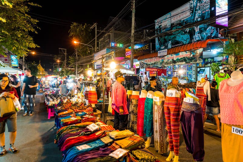 Chiang Mai, Thailand - Jan 1, 2018 : Tourists traveling at Night Market in Chiang Mai, Thailand. Chiang Mai, Thailand - Jan 1, 2018 : Tourists traveling at Night Market in Chiang Mai, Thailand.