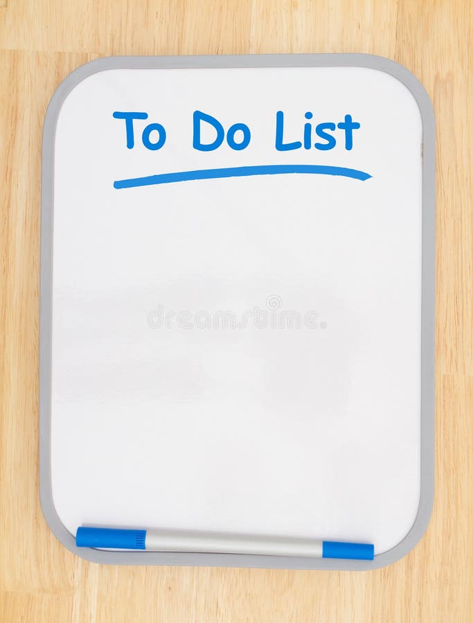 To do list on white dry erase board with marker on wood textured wall with copy space for your message. To do list on white dry erase board with marker on wood textured wall with copy space for your message