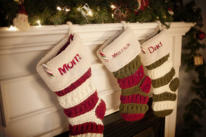 Christmas Stockings hanging on the fireplace during the holidays. Christmas Stockings hanging on the fireplace during the holidays