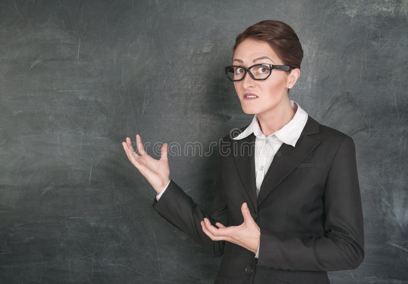 Crazy teacher on the school blackboard background. Crazy teacher on the school blackboard background