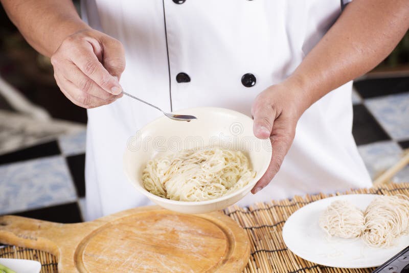 Chef cooking Noodle with seasoning sauce / Cooking Noodle concept. Chef cooking Noodle with seasoning sauce / Cooking Noodle concept