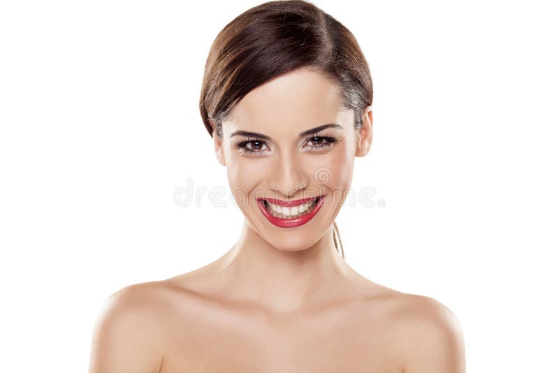 Young beautiful woman with a wide teeth smile posing on white background. Young beautiful woman with a wide teeth smile posing on white background