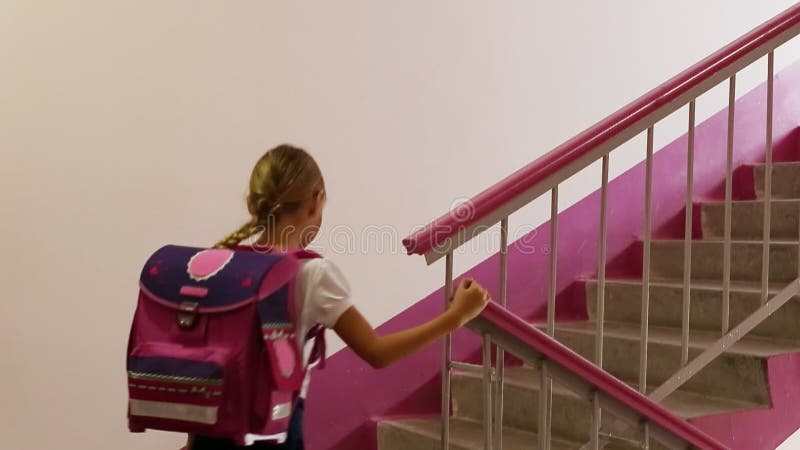 Schoolgirl goes up house school stairs back school to Go home Go up class room Girl back color p stock video - Video counting education, girl: 98239981         