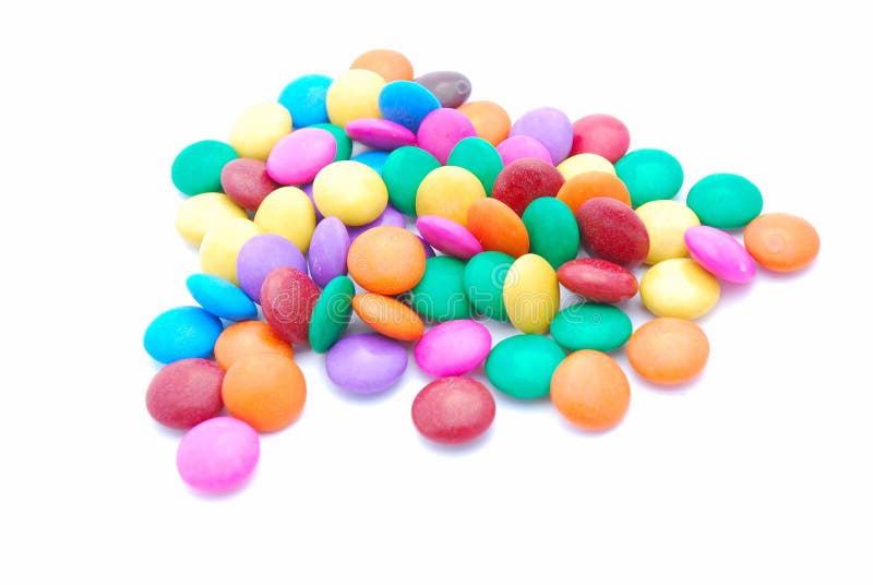 Heap of colorful round chocolate sweets for kids. Image isolated on white studio background. Heap of colorful round chocolate sweets for kids. Image isolated on white studio background.