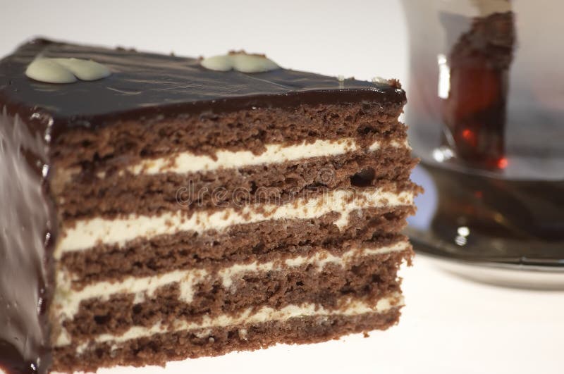 Chocolate cake close-up on white background. Chocolate cake close-up on white background