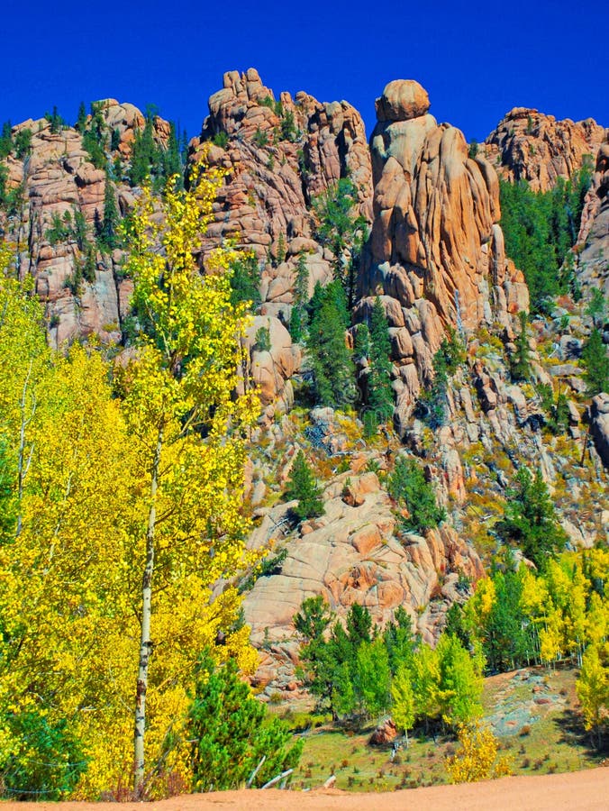 What happens when nature compiles sandstone, limestone and places it all behind golden aspens under an azure sky? The Cathedral Spires along Gold Camp Road in Colorado!. What happens when nature compiles sandstone, limestone and places it all behind golden aspens under an azure sky? The Cathedral Spires along Gold Camp Road in Colorado!