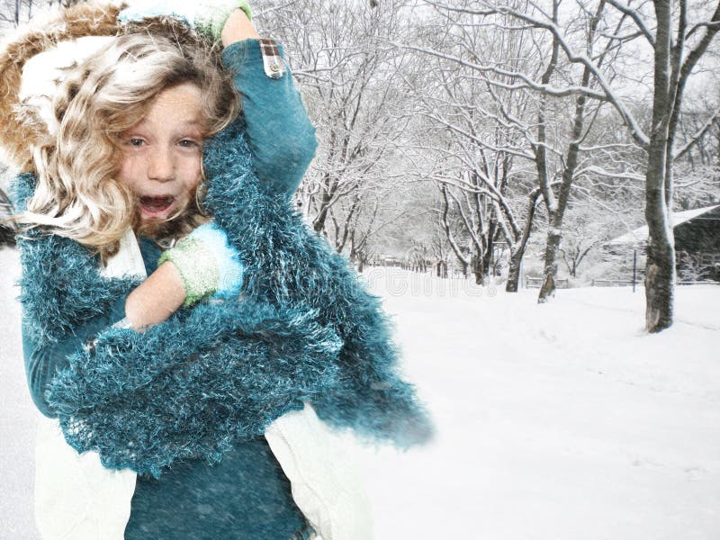 Freezing cold seven year old girl in snow storm outside. Freezing cold seven year old girl in snow storm outside.