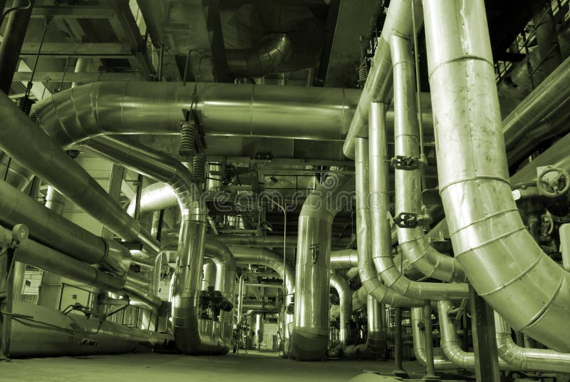 Different types of pipes and tanks inside energy plant. Different types of pipes and tanks inside energy plant