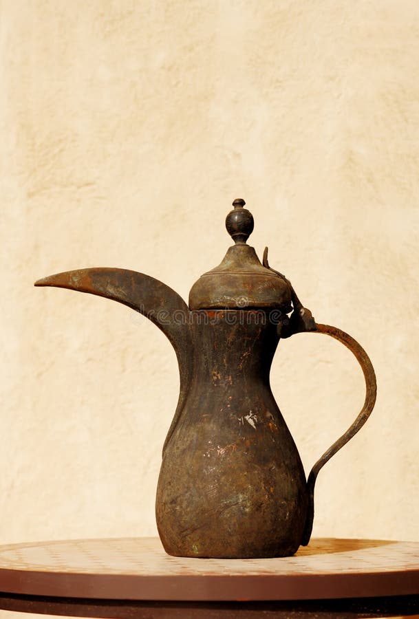 This is an ancient Arabic Beduin tea pot. Arabic tea is a proud hospitality tradition in the Gulf of Arabia. This is an ancient Arabic Beduin tea pot. Arabic tea is a proud hospitality tradition in the Gulf of Arabia