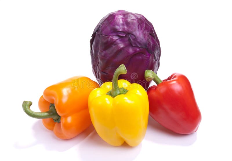 A selection of Brightly Coloured Vegetables isolated against white background. A selection of Brightly Coloured Vegetables isolated against white background.