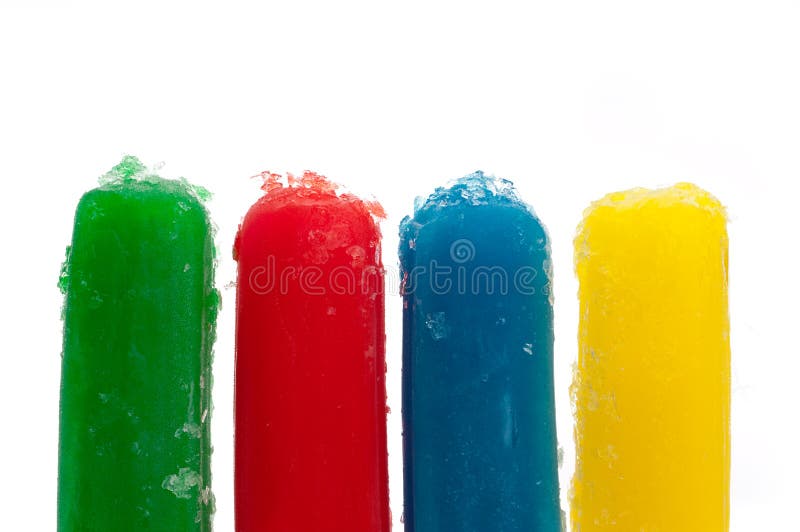 Brightly colored frozen popsicles on white. Brightly colored frozen popsicles on white