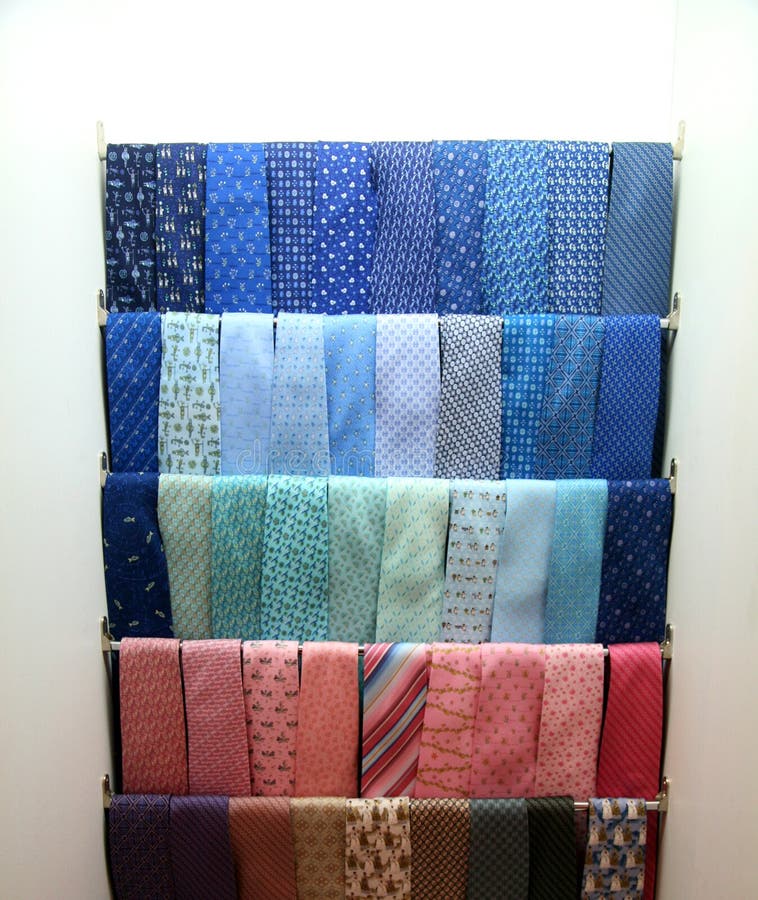 Collection of brightly-colored neck ties on racks. Collection of brightly-colored neck ties on racks