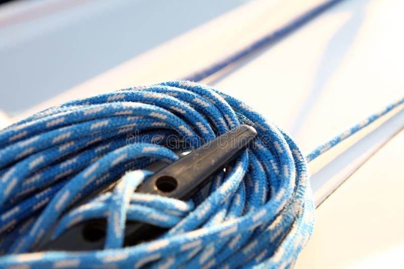 Summer theme. sailboater's equipment on yacht - blue rope. Summer theme. sailboater's equipment on yacht - blue rope