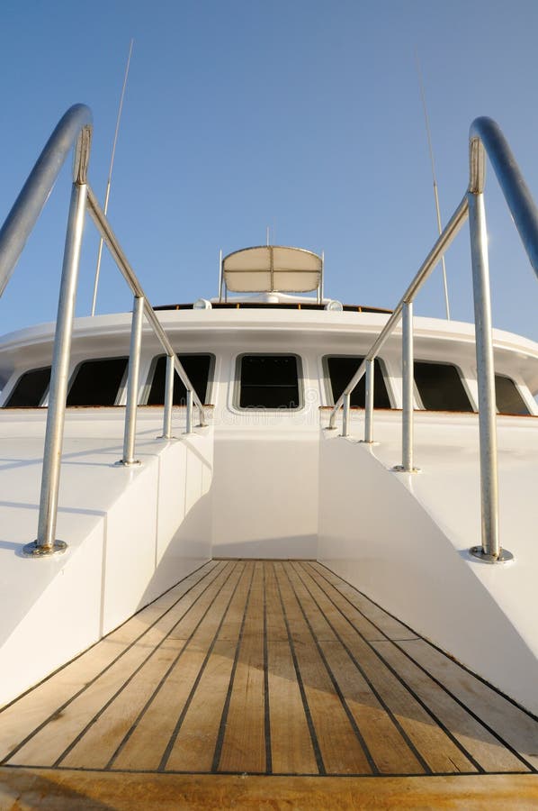 Deck of big wooden marine yacht with ladder and deck cabin. Deck of big wooden marine yacht with ladder and deck cabin