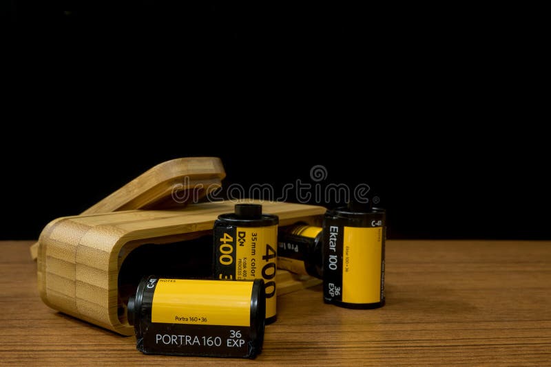 A Group of 35 mm Negative  films : Kodak Film in different Model :Procolor ,Portra ,Gold with The Wooden Film Case. A Group of 35 mm Negative  films : Kodak Film in different Model :Procolor ,Portra ,Gold with The Wooden Film Case