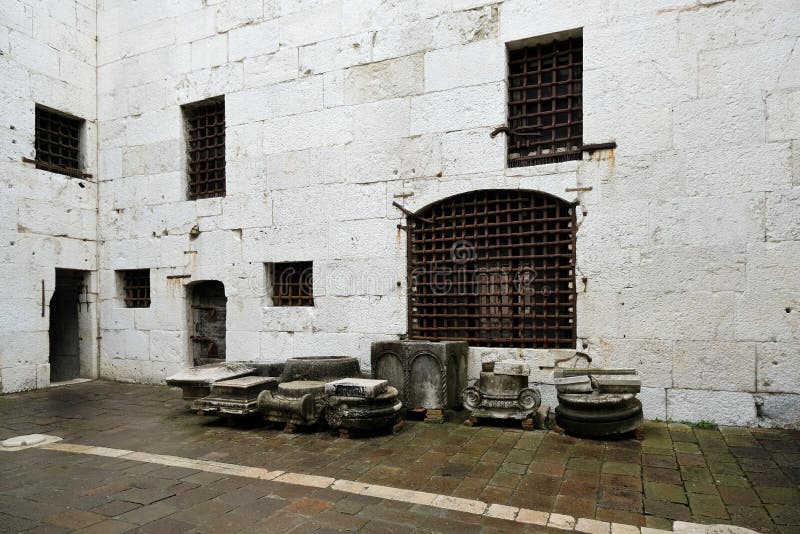 Small courtyard of an old italian prison in doge`s palace, venice- view onprison cell windows. Small courtyard of an old italian prison in doge`s palace, venice- view onprison cell windows