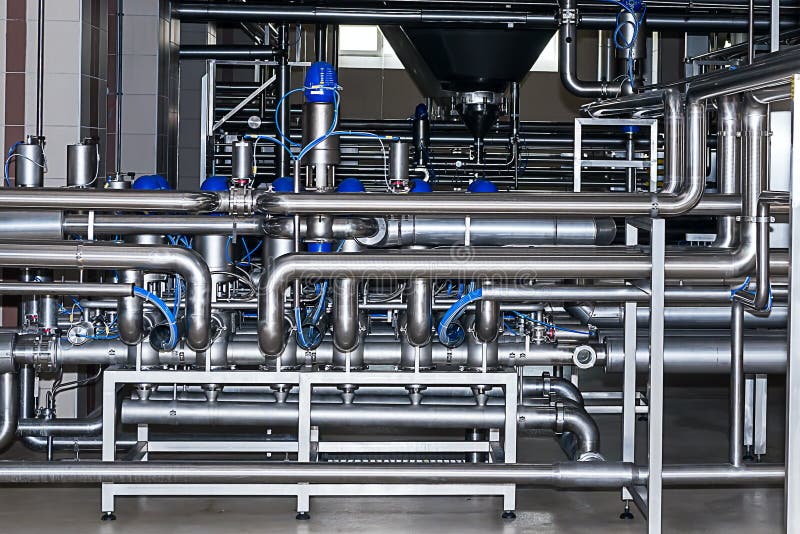 Stainless pipes,pumps and valves in modern brewery. Stainless pipes,pumps and valves in modern brewery.