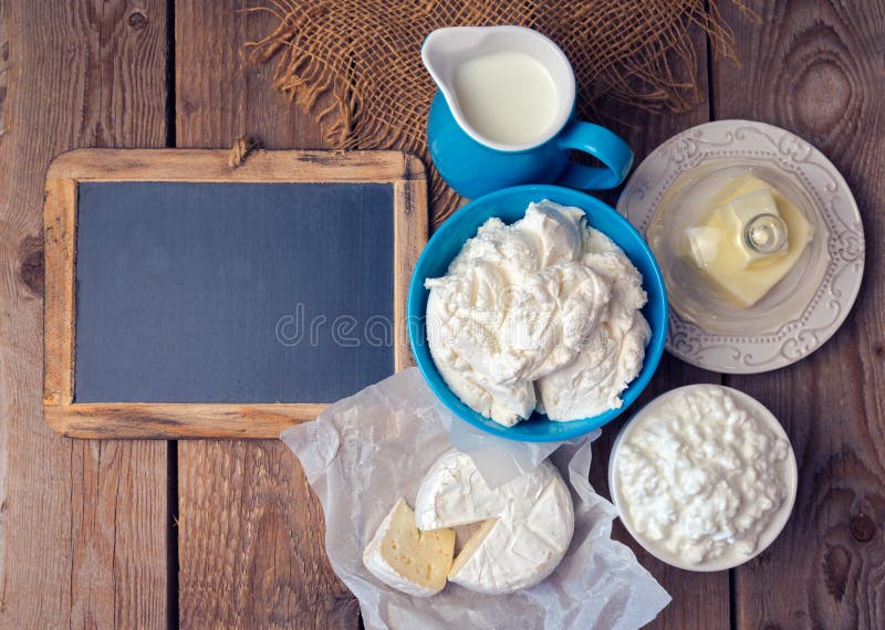 Background with chalkboard, milk and cottage cheese. Background with chalkboard, milk and cottage cheese.