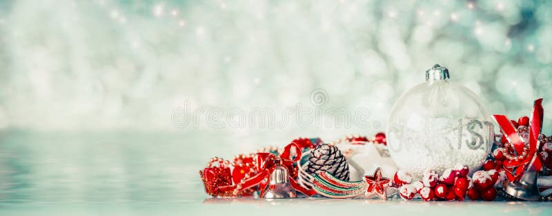 Christmas background with glass balls and red festive decoration at winter bokeh background, front view, banner. Christmas background with glass balls and red festive decoration at winter bokeh background, front view, banner