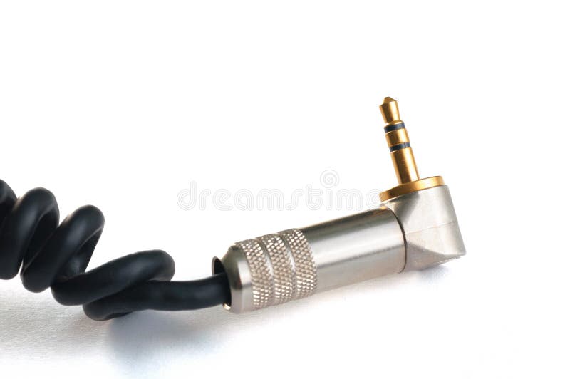 Professional audio instrumental cable with 3.5mm gold stereo plug isolated on white close up. Professional audio instrumental cable with 3.5mm gold stereo plug isolated on white close up