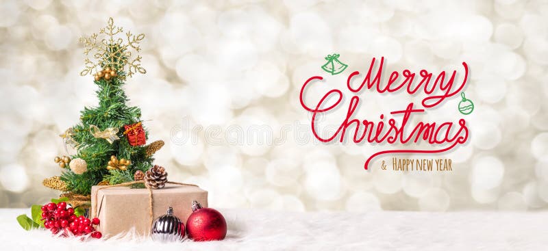 Red Merry Christmas and happy new year handwriting with xmas tree and gift box at blur bokeh light background,Winter holiday banner greeting card. Red Merry Christmas and happy new year handwriting with xmas tree and gift box at blur bokeh light background,Winter holiday banner greeting card