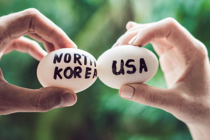 Eggs with the inscriptions of Russia and the United States, fight, who are broken. conflict between USA vs Russia, governments conflict concept. Eggs with the inscriptions of Russia and the United States, fight, who are broken. conflict between USA vs Russia, governments conflict concept.