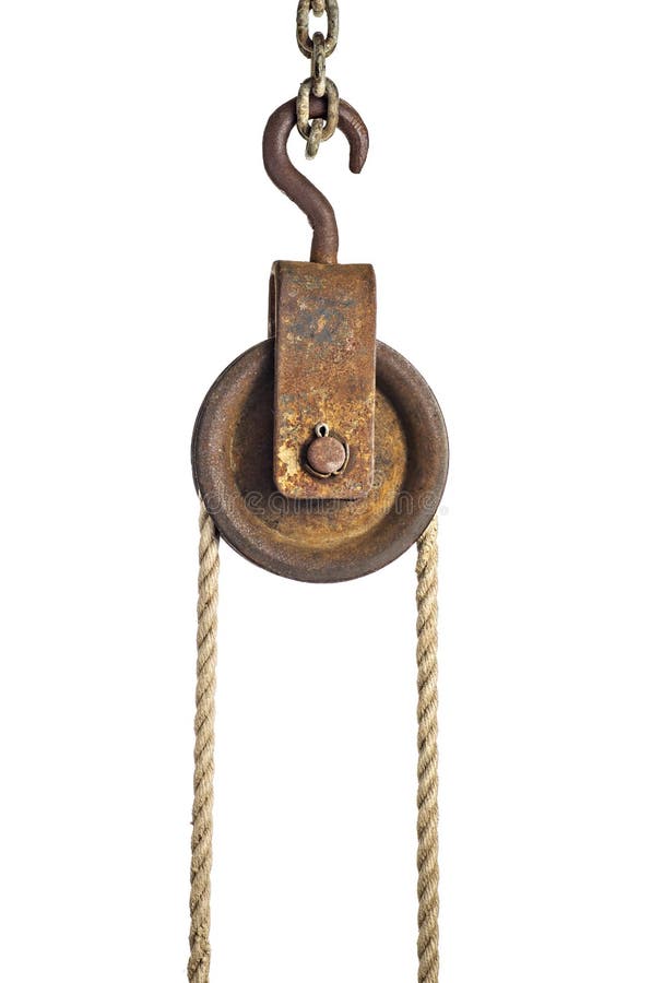An old pulley with a rope. An old pulley with a rope