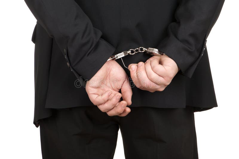 Business man breaking handcuffs isolated. Business man breaking handcuffs isolated