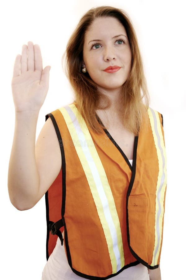 Woman wearing traffic director's jacket. Woman wearing traffic director's jacket