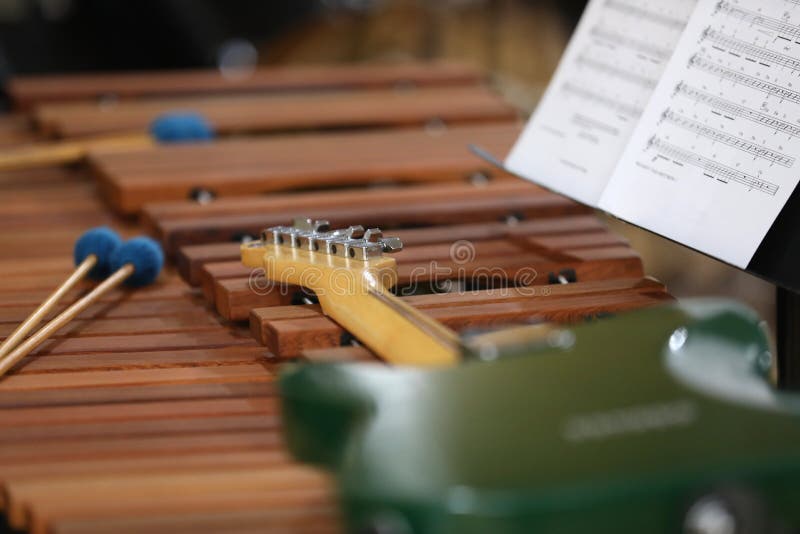 A variety of musical instruments and sheet music illustrating a band or orchestra and some equipment. Professional musician or learning to play. Performing arts concept. Full size can be cropped. A variety of musical instruments and sheet music illustrating a band or orchestra and some equipment. Professional musician or learning to play. Performing arts concept. Full size can be cropped