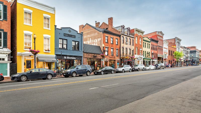 WASHINGTON DC - MAY, 6, 2018: Georgetown shopping district along M Street. M street hosts a large variety of shops from indie to home design, high-end boutiques and national and international retail. WASHINGTON DC - MAY, 6, 2018: Georgetown shopping district along M Street. M street hosts a large variety of shops from indie to home design, high-end boutiques and national and international retail.