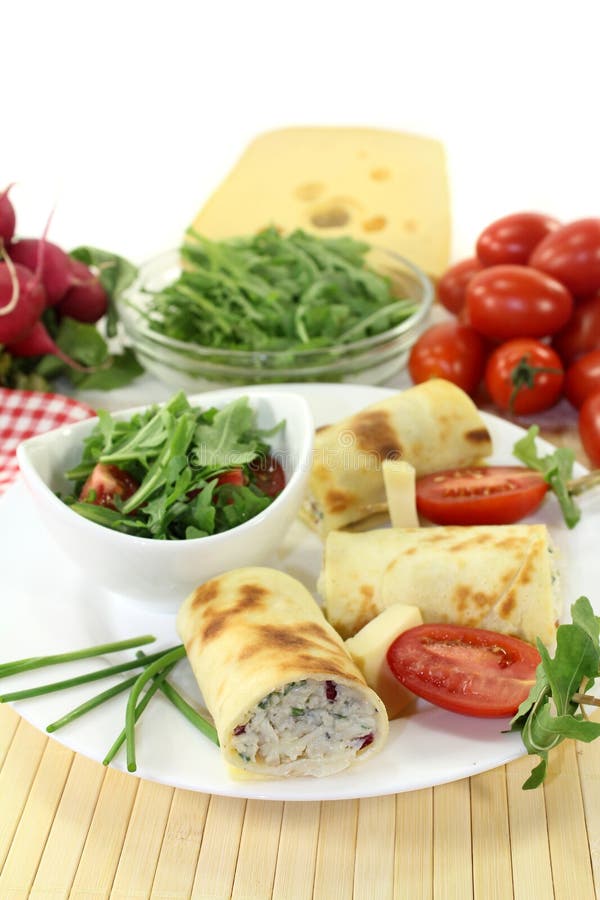 A crepe stuffed with cheese, radishes and chives. A crepe stuffed with cheese, radishes and chives