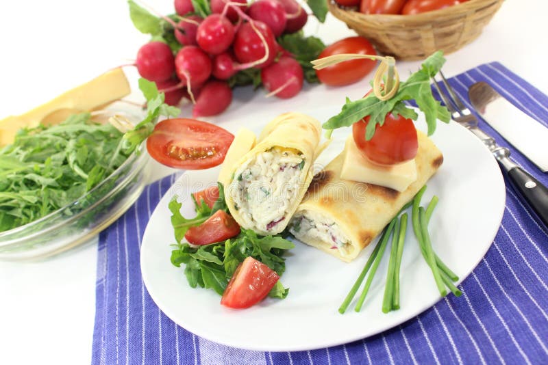 A crepe stuffed with cheese, radishes and chives. A crepe stuffed with cheese, radishes and chives