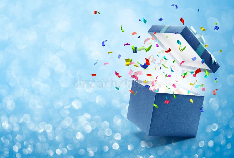 Confetti popping out from blue gift box - bokeh background. Confetti popping out from blue gift box - bokeh background