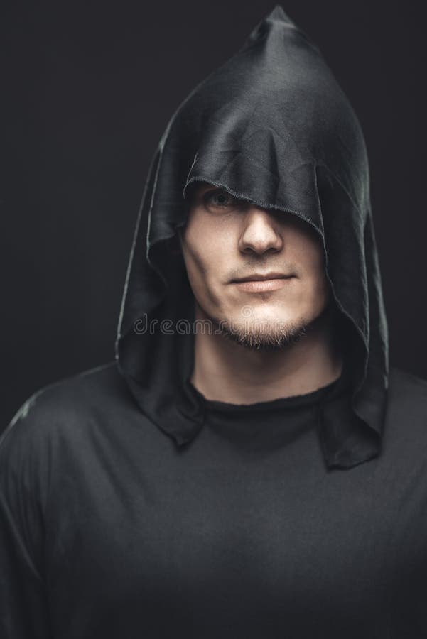 Portrait of a Man in a black robe on a dark background. Portrait of a Man in a black robe on a dark background