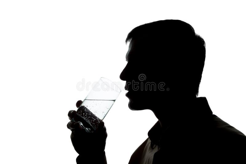 Young man drinking a glass of sparkling water - silhouette. Young man drinking a glass of sparkling water - silhouette