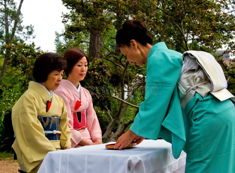 Houston, Texas --- Apr 26, 2009. The host and her two guests in an outdoor tea ceremony in Houston Hermann Park Japanese Garden at the 16th annual Houston Japan Festival. Houston, Texas --- Apr 26, 2009. The host and her two guests in an outdoor tea ceremony in Houston Hermann Park Japanese Garden at the 16th annual Houston Japan Festival.